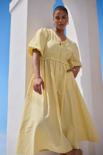 Woman in a yellow striped dress.