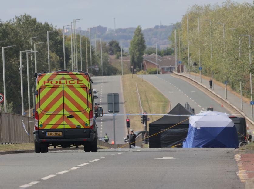 Police at a fatal car accident scene.