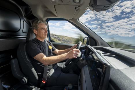 Man driving a van.