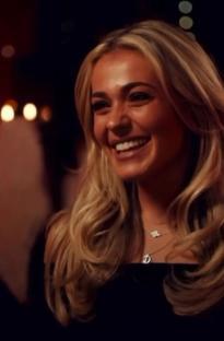 Demi Sims smiling.