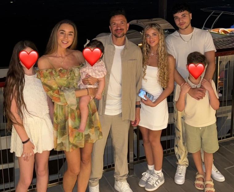 Family photo at night by the water.