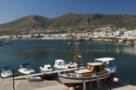 Aerial view of Heraklion, Crete, showing the city, harbor, and coastline.