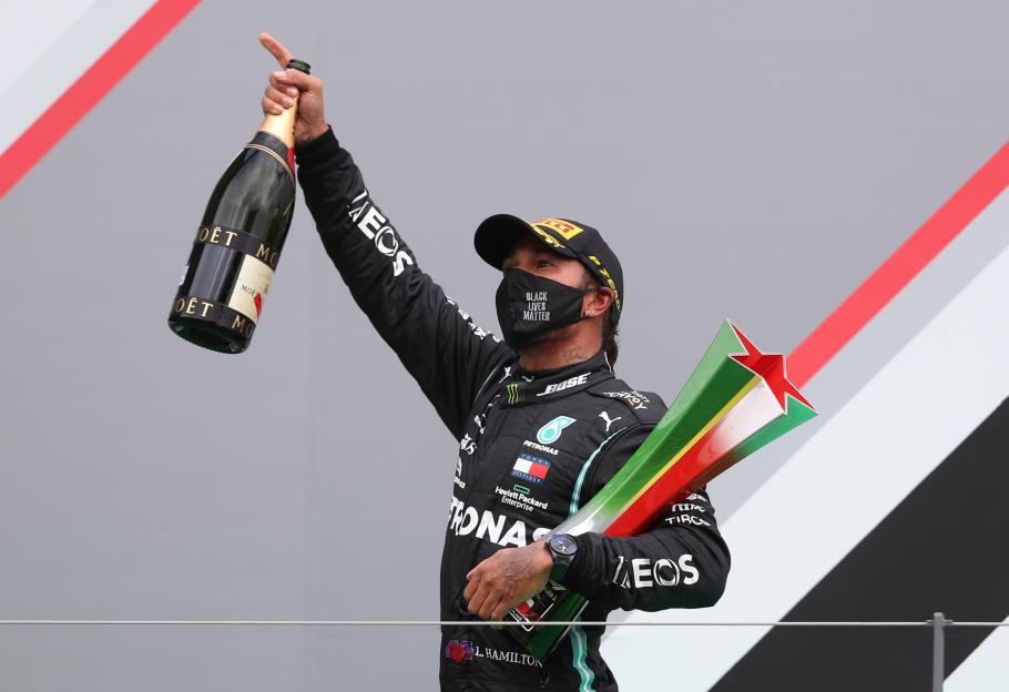 Lewis Hamilton celebrates a Formula One race win.