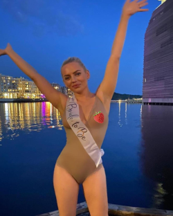 Bride-to-be in swimsuit at night.