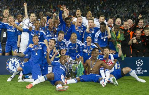 Chelsea football team celebrates winning the Champions League trophy.