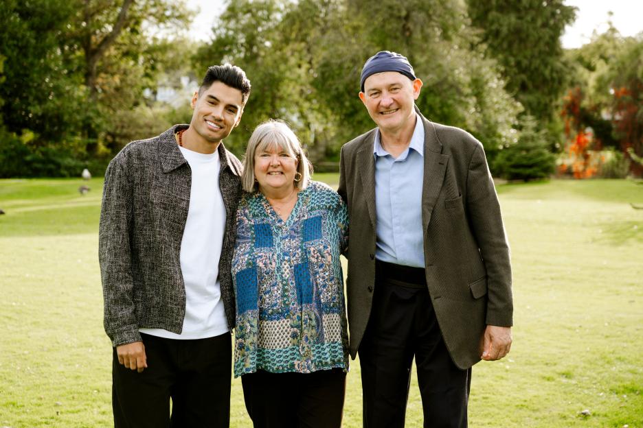 Siva Kaneswaran, Ed Brady, and his wife, smiling outdoors.