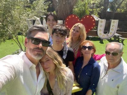 Group photo of Brandi Glanville, Eddie Cibrian, LeAnn Rimes, and their families at an Easter gathering.
