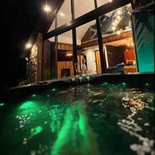 Hot tub at a luxury barn at night.