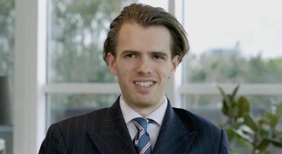 Portrait of a man in a suit.