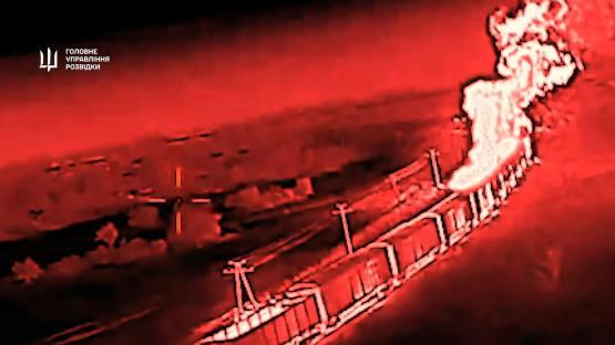 Drone footage of a burning Ukrainian train after an attack.