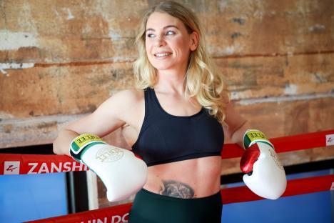 3AC5GY2 PRODUCTION - 28 March 2025, Hamburg: Natalie Zimmermann, professional boxer and WIBF super lightweight world champion, at a photo session at the ZanShin Dojo martial arts school. The Hamburg native is Udo Lindenberg's personal trainer and wants to fight for her third world title in England in May. Photo: Christian Charisius/dpa