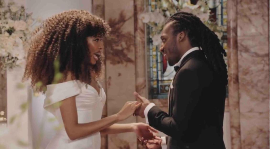 Julia Ruth and Divarni from Married at First Sight holding hands.