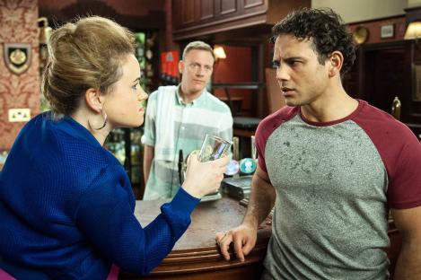 A woman accuses a man of murder in a pub.