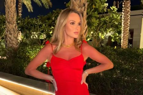 Amanda Holden looks incredible as she poses in backless figure-hugging red dress on holiday in Dubai