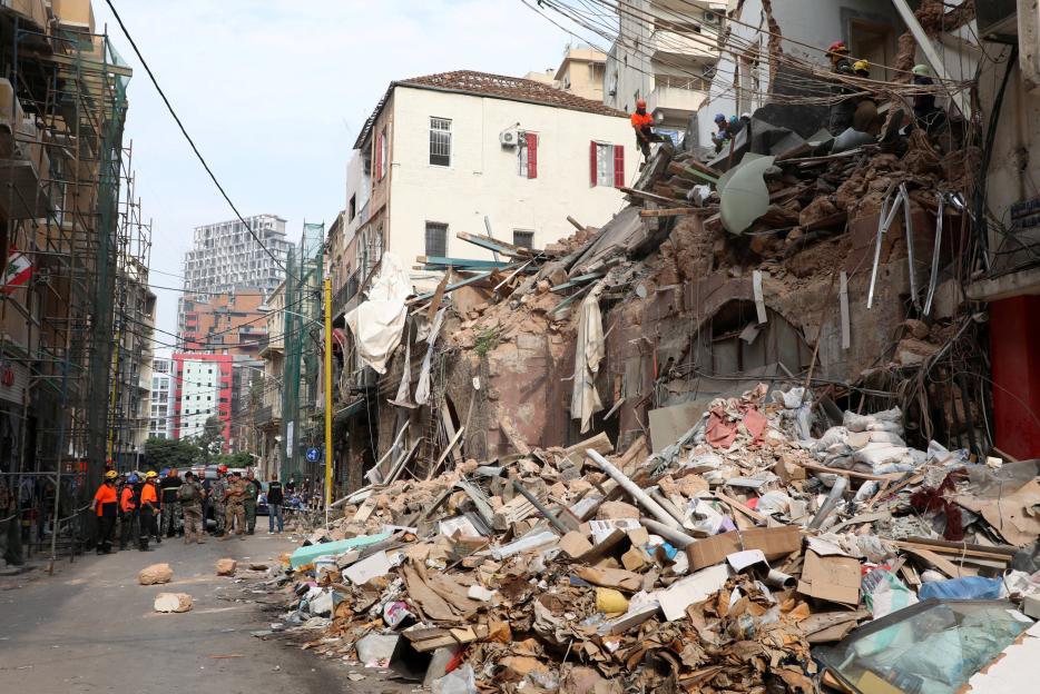 A rescue team searches through the rubble of damaged buildings in Beirut, Lebanon.