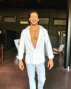 Man in white shirt and light blue pants.