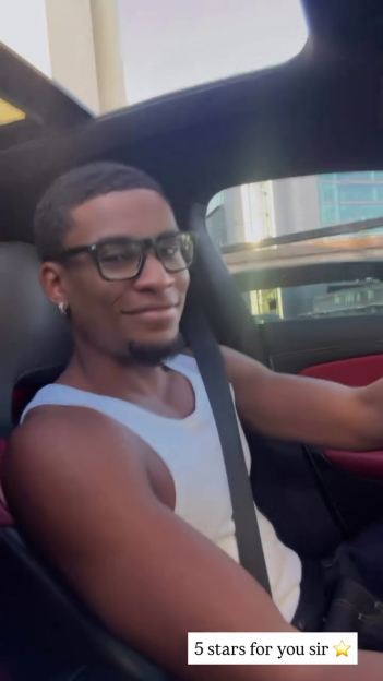 Man smiling in a car.
