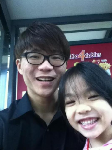 Man and girl smiling for a selfie.