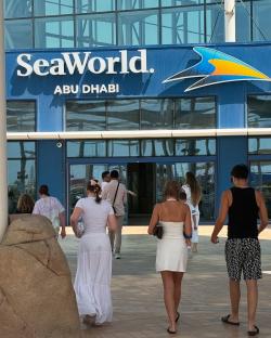 People walking into SeaWorld Abu Dhabi.