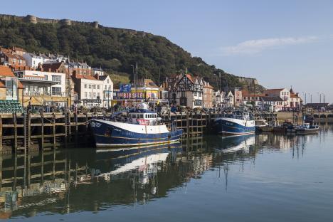 Fishing boats docked at a harbor in Scarborough.