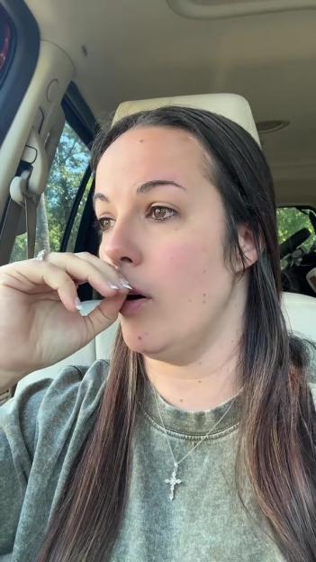 Woman crying in a car.
