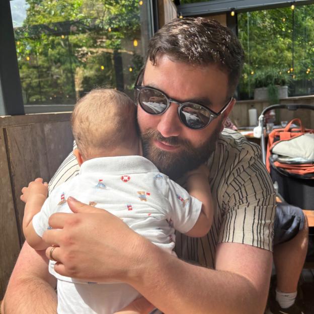 A father hugging his baby.