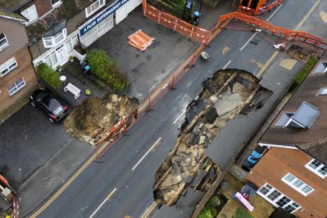 Huge 65ft sinkhole that forced families to evacuate ‘could take months to fix’ due to ‘network of hidden tunnels’