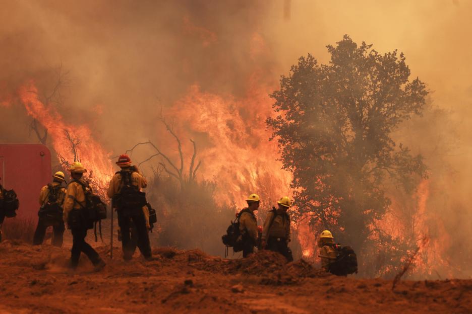 Firefighters battling a wildfire.
