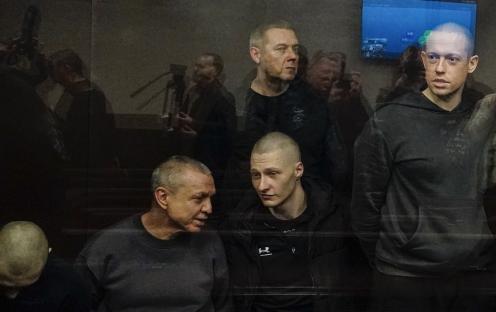 Ukrainian prisoners of war in a Russian courtroom.