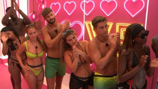 Islanders from Love Island reacting to a difficult decision.