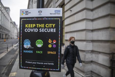 COVID-19 safety sign: Keep the city Covid secure. Wash hands, wear face mask, maintain social distance.