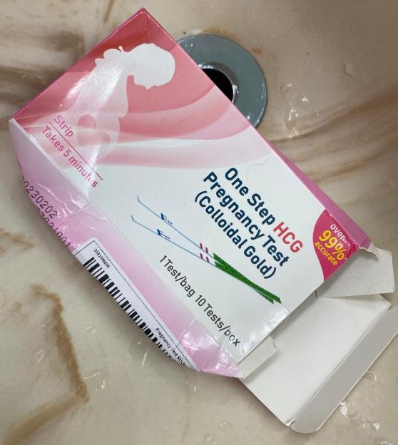 A partially opened box of pregnancy tests.