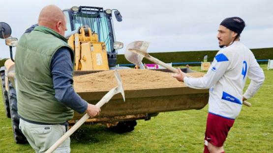 Match suspended as striker brings digger on to pitch to fill SINKHOLE after rival swallowed up by the ground