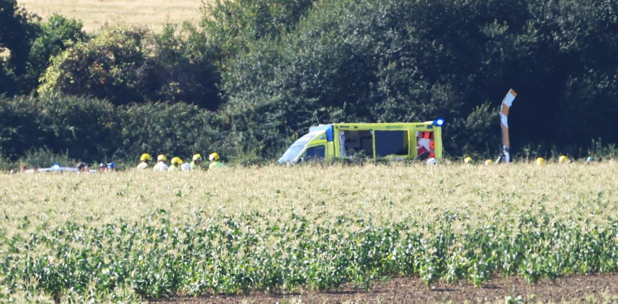 Emergency responders at the scene of a helicopter crash.