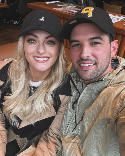 Katie McGlynn and Ricky Rayment smiling at the camera.