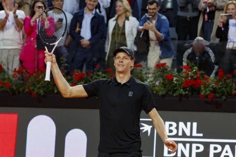 Jannik Sinner of Italy celebrates a tennis match victory.