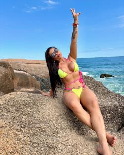 Pregnant woman holding her belly.