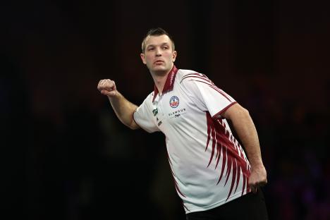 Madars Razma of Latvia reacting during a darts match.