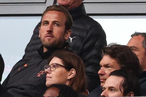 Harry Kane of Bayern Munich in the stands at a Bundesliga match.
