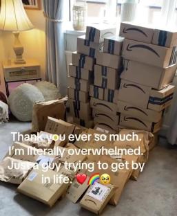 A large pile of Amazon packages on a floor.