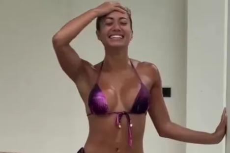 Love Island’s Kaz Crossley sizzles in tiny bikini as she gets soaked in the rain on holiday in Thailand