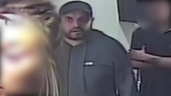 CCTV still image of a man realizing his crime was caught on camera.