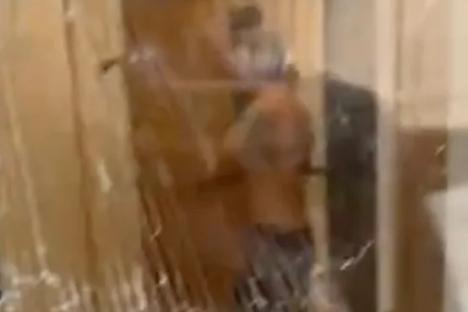 Moment neighbour smashes flats with axe in horror siege – before donning scuba gear, clutching spear & hiding in bathtub