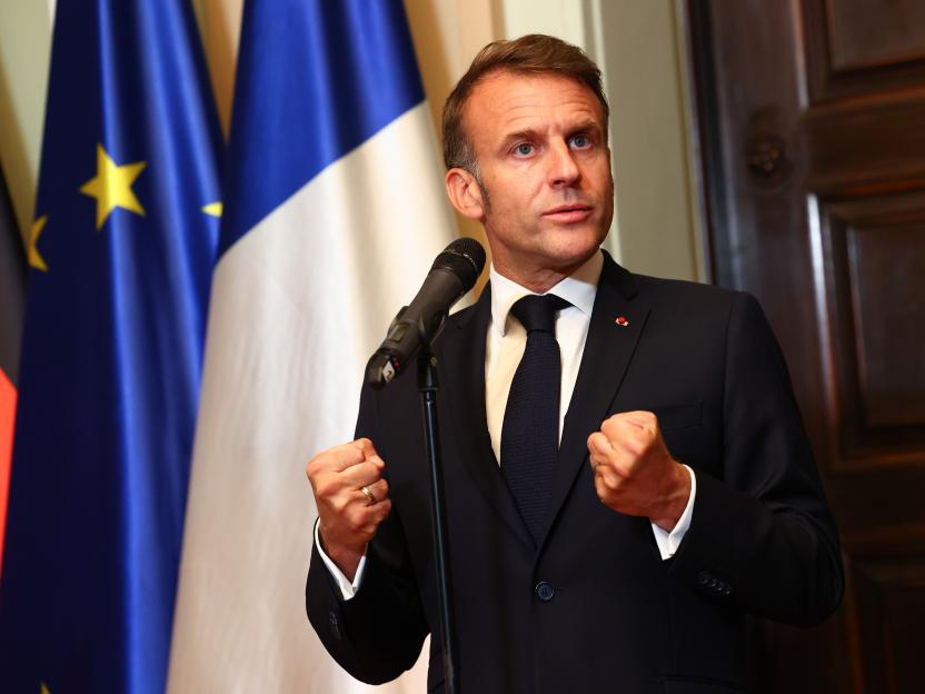 Emmanuel Macron speaking at a press conference.