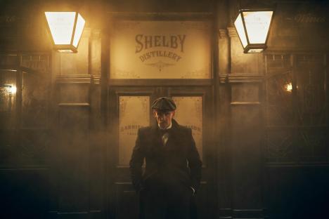 Arthur Shelby standing outside Shelby Distillery.