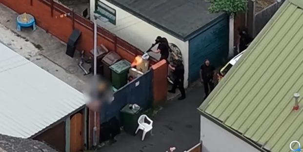 Moment armed police shoot and kill dog after child mauled and cop bitten in terrifying attack in back garden