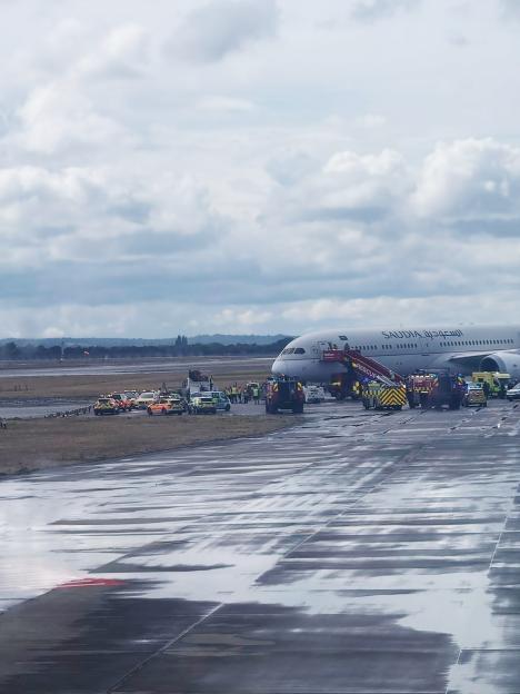 Moment cops surround plane at Heathrow after ‘berserk’ passenger ‘punched crew member and tried to open door’