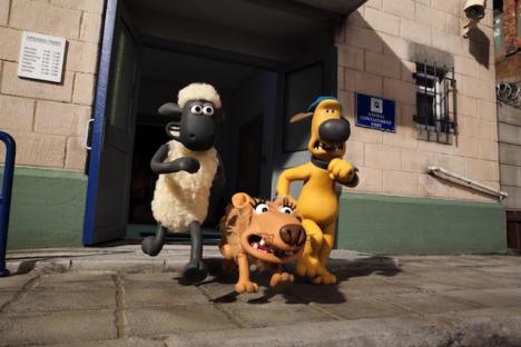 Shaun the Sheep, Bitzer, and a lion running away from the Animal Containment Unit.