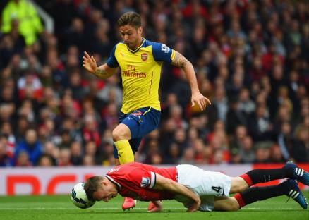 Phil Jones heading the ball during a Manchester United vs. Arsenal match.