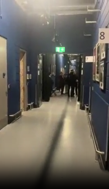 People in a hallway.
